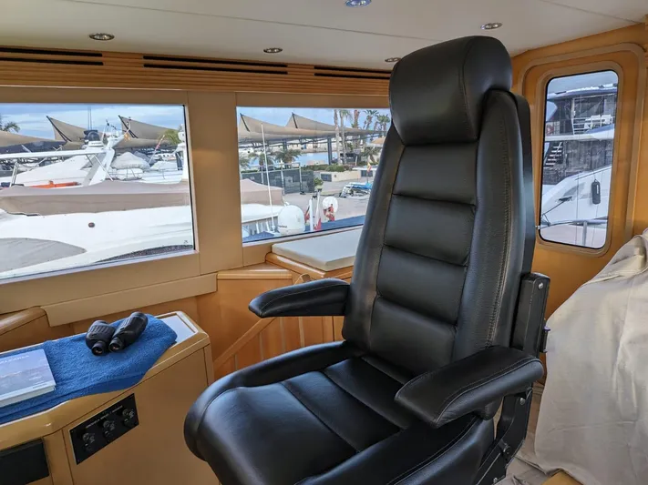  Yacht Photos Pics Captain's chair in the helm of a 2001 Hatteras 70 Convertible yacht.