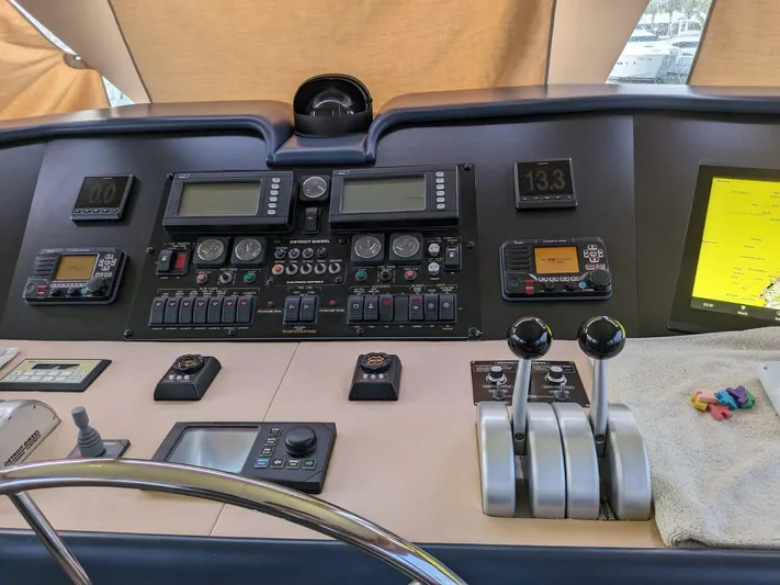  Yacht Photos Pics Control panel of a 2001 Hatteras 70 Convertible yacht with navigation and throttle controls.