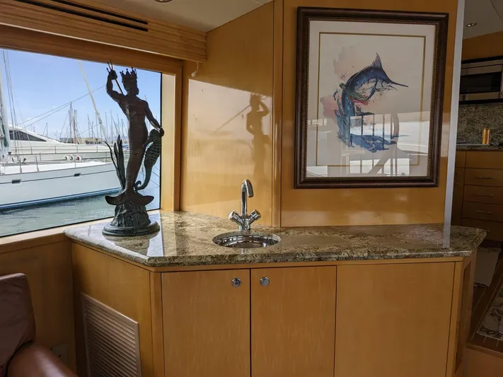  Yacht Photos Pics Interior of 2001 Hatteras 70 Convertible yacht with granite countertop and nautical decor.