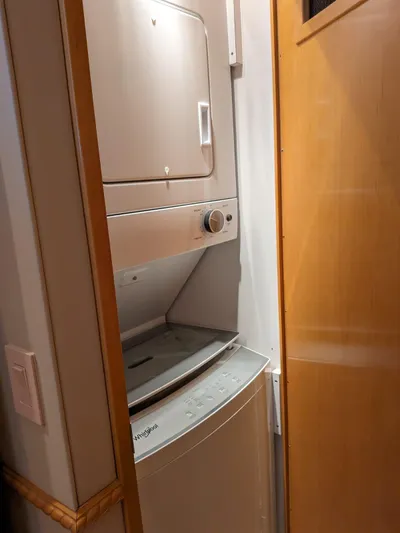  Yacht Photos Pics Stacked washer and dryer in 2001 Hatteras 70 Convertible yacht.