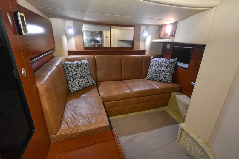 Pure Fun Yacht Photos Pics Luxurious interior of 2007 Sea Ray 40 Sundancer with leather seating and decorative pillows.