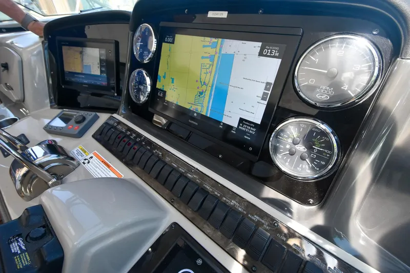 Pure Fun Yacht Photos Pics Dashboard of 2007 Sea Ray 40 Sundancer with navigation screens and gauges.