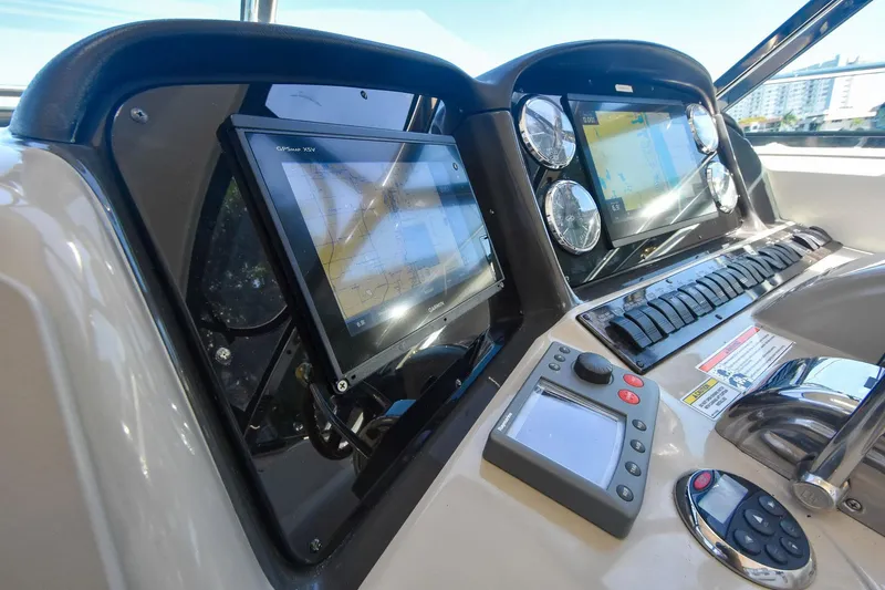 Pure Fun Yacht Photos Pics Control panel of 2007 Sea Ray 40 Sundancer with navigation screens and instruments.