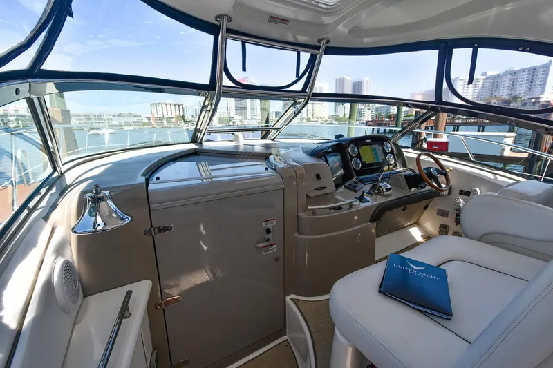 Pure Fun Yacht Photos Pics 2007 Sea Ray 40 Sundancer helm with modern controls and waterfront view.