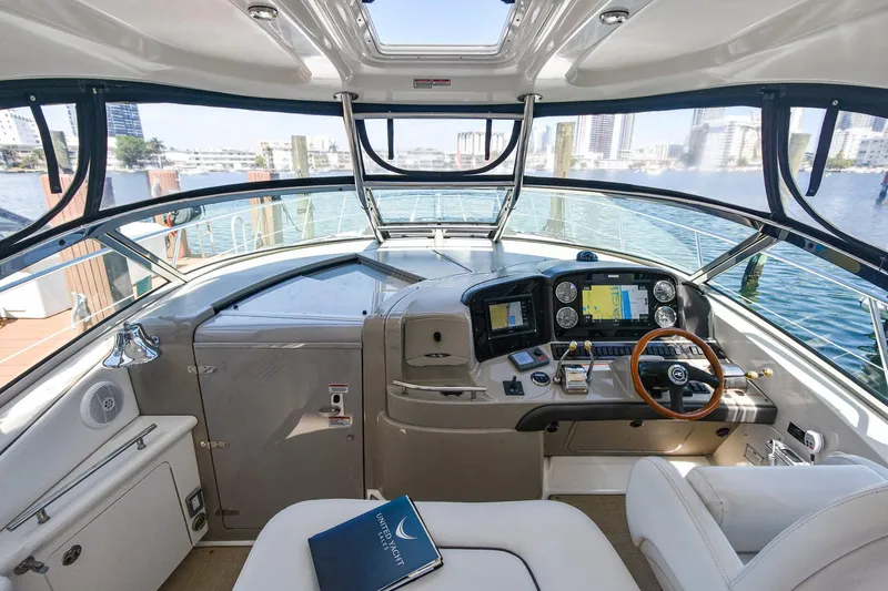 Pure Fun Yacht Photos Pics 2007 Sea Ray 40 Sundancer helm with modern navigation equipment and panoramic water views.
