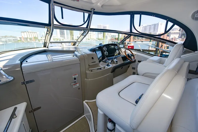 Pure Fun Yacht Photos Pics 2007 Sea Ray 40 Sundancer helm with modern controls and panoramic windows.