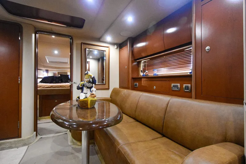Pure Fun Yacht Photos Pics Luxurious 2007 Sea Ray 40 Sundancer interior with leather seating and elegant wood finishes.