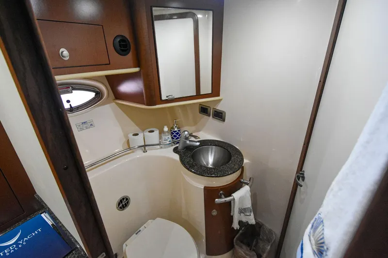 Pure Fun Yacht Photos Pics Luxurious bathroom in 2007 Sea Ray 40 Sundancer yacht with modern fixtures and elegant design.