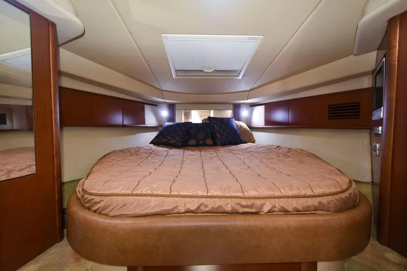 Pure Fun Yacht Photos Pics Luxurious cabin interior of 2007 Sea Ray 40 Sundancer yacht with cozy bed.