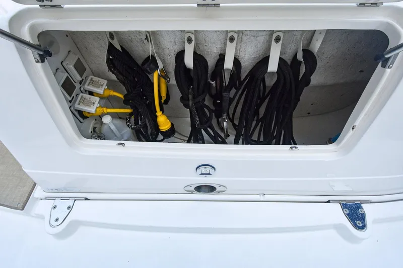 Pure Fun Yacht Photos Pics Storage compartment with cables on a 2007 Sea Ray 40 Sundancer boat.