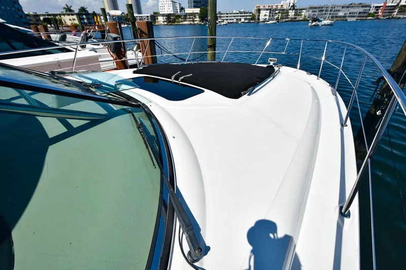 Pure Fun Yacht Photos Pics 2007 Sea Ray 40 Sundancer yacht docked, showcasing sleek deck design and waterfront view.