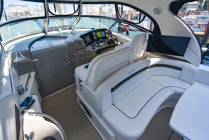 Pure Fun Yacht Photos Pics Interior of 2007 Sea Ray 40 Sundancer yacht with modern helm and plush seating.