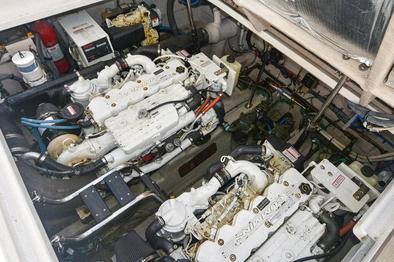 Pure Fun Yacht Photos Pics Engine room of a 2007 Sea Ray 40 Sundancer with dual engines and mechanical components.