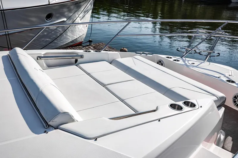  Yacht Photos Pics 2021 Regal 36 Grande Coupe boat with spacious white seating area and cup holders.