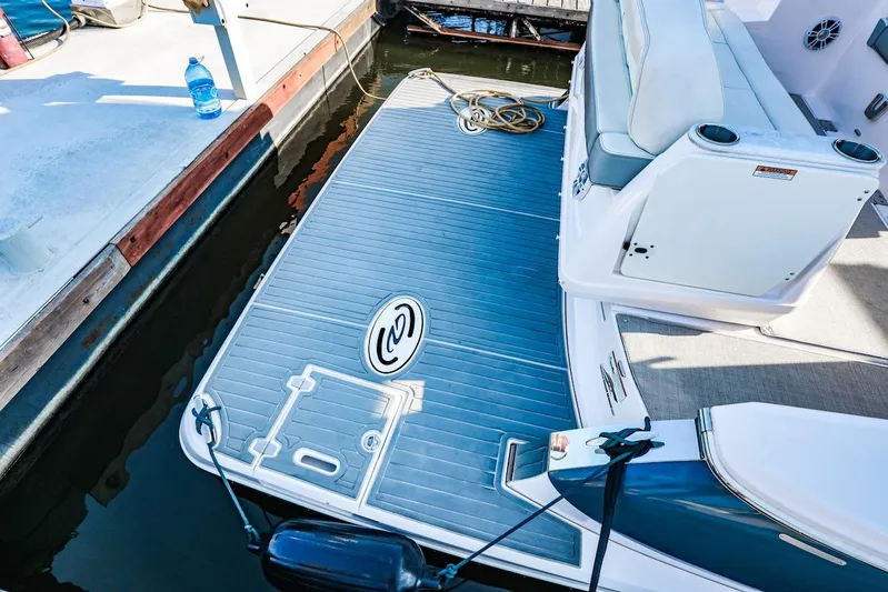  Yacht Photos Pics 2021 Regal 36 Grande Coupe boat deck with seating at marina.