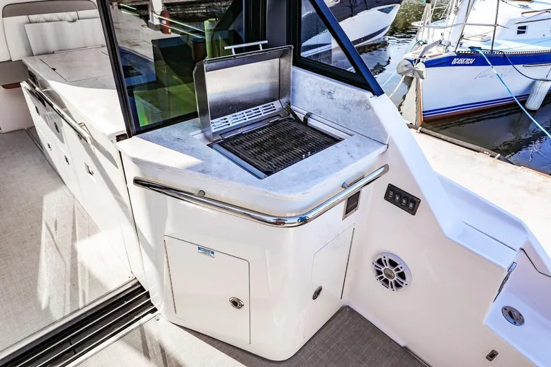  Yacht Photos Pics Outdoor grill on 2021 Regal 36 Grande Coupe yacht, featuring sleek design and modern amenities.