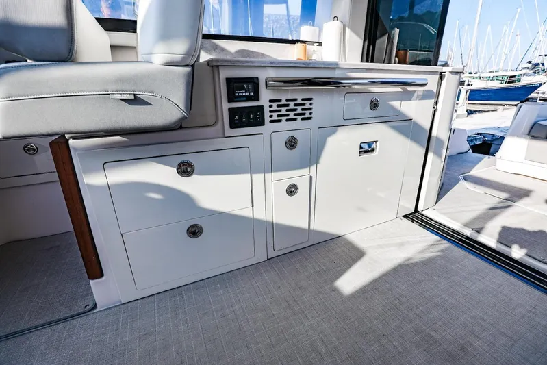  Yacht Photos Pics Interior of 2021 Regal 36 Grande Coupe yacht, featuring sleek cabinetry and seating.