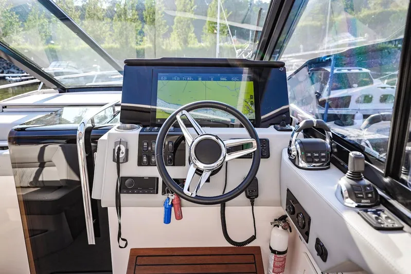  Yacht Photos Pics 2021 Regal 36 Grande Coupe helm with navigation display and controls.