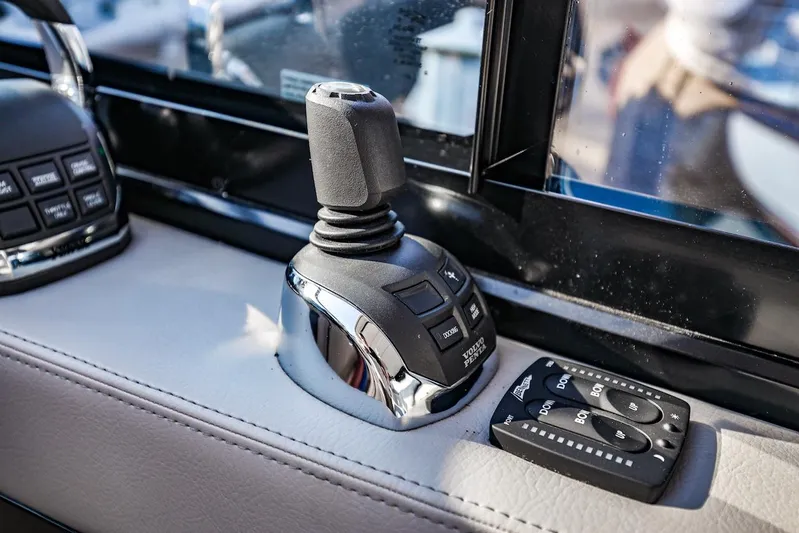  Yacht Photos Pics Control panel of 2021 Regal 36 Grande Coupe boat, featuring joystick and buttons.
