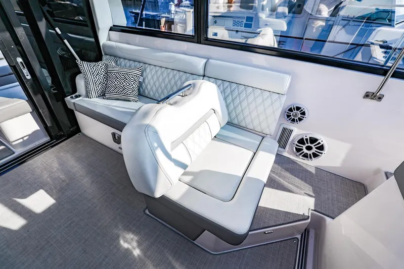  Yacht Photos Pics Luxurious interior seating of 2021 Regal 36 Grande Coupe yacht with stylish cushions.