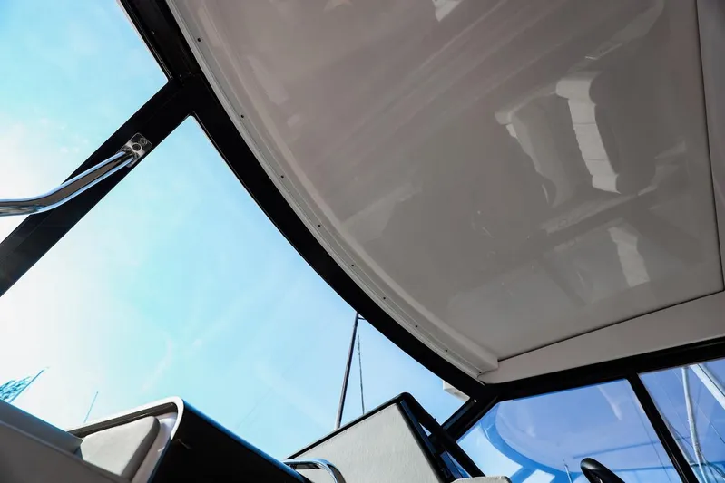  Yacht Photos Pics Interior view of 2021 Regal 36 Grande Coupe boat with sleek design and clear windows.