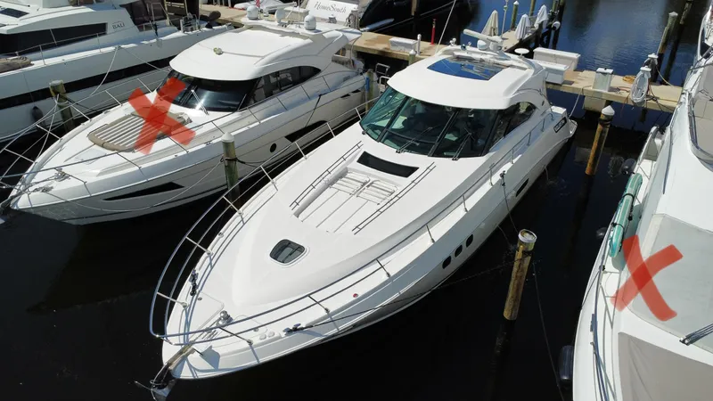  Yacht Photos Pics 2010 Sea Ray 540 Sundancer yacht docked at marina, surrounded by other boats.
