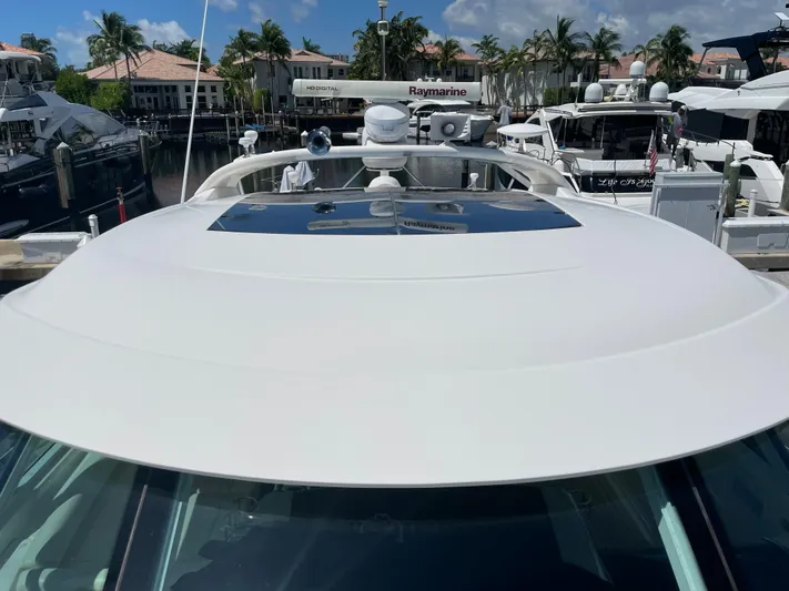  Yacht Photos Pics 2010 Sea Ray 540 Sundancer yacht docked at marina with clear sky and palm trees.