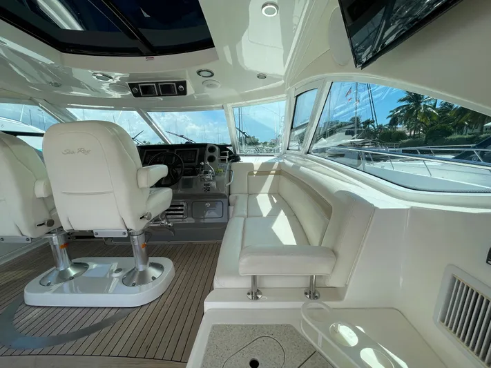  Yacht Photos Pics Luxurious interior of 2010 Sea Ray 540 Sundancer yacht with plush seating and modern helm.