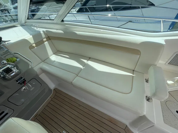  Yacht Photos Pics 2010 Sea Ray 540 Sundancer interior with white seating and wooden flooring.