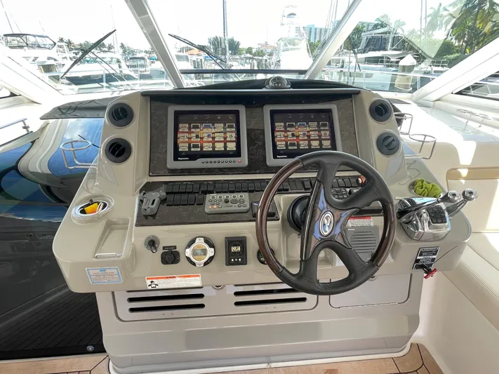 Yacht Photos Pics Helm of 2010 Sea Ray 540 Sundancer with dual displays and steering wheel.