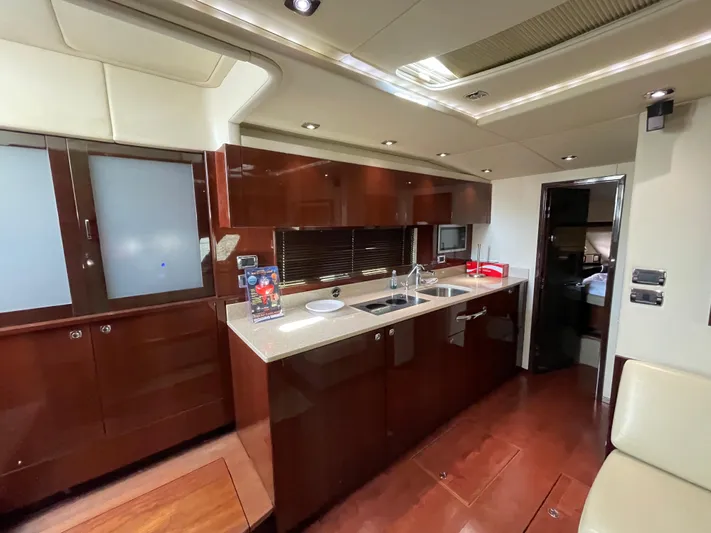  Yacht Photos Pics Luxurious kitchen interior of 2010 Sea Ray 540 Sundancer yacht with modern amenities.
