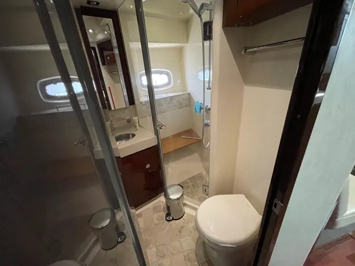  Yacht Photos Pics Bathroom interior of 2010 Sea Ray 540 Sundancer yacht, featuring shower and toilet.
