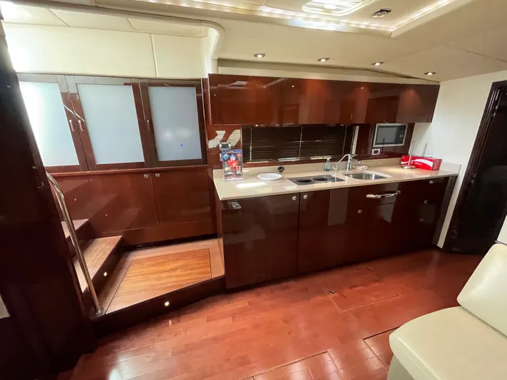  Yacht Photos Pics Luxurious interior of 2010 Sea Ray 540 Sundancer yacht with modern kitchen amenities.