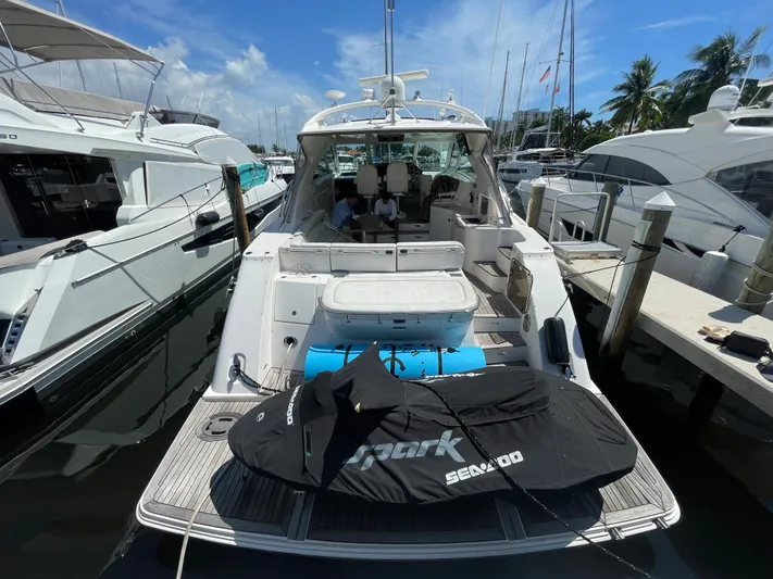  Yacht Photos Pics 2010 Sea Ray 540 Sundancer yacht docked with jet ski on deck.