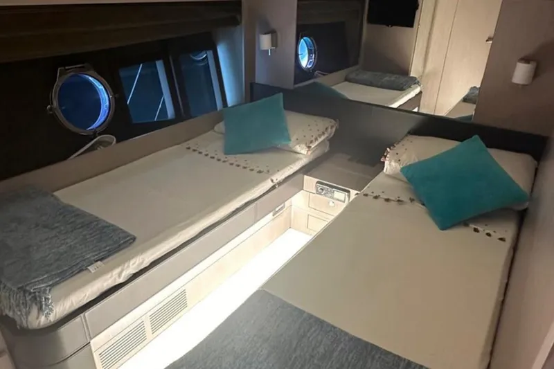  Yacht Photos Pics Interior of 2013 Riva 75 Venere Super yacht with twin beds and porthole window.