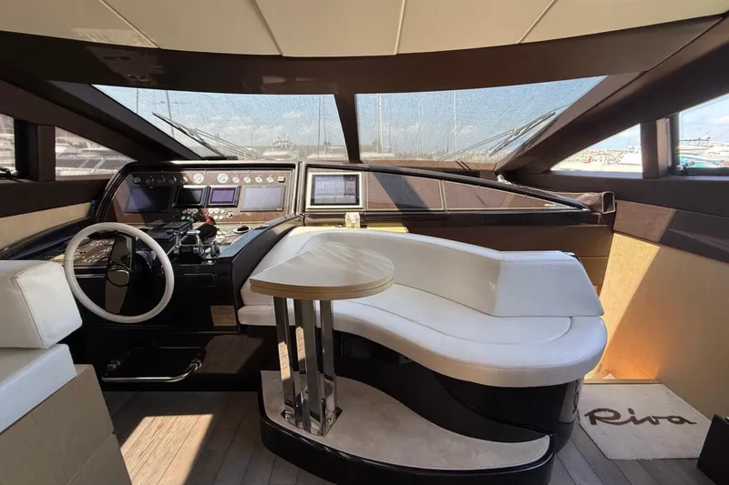  Yacht Photos Pics Luxurious interior of 2013 Riva 75 Venere Super yacht with modern helm and seating area.