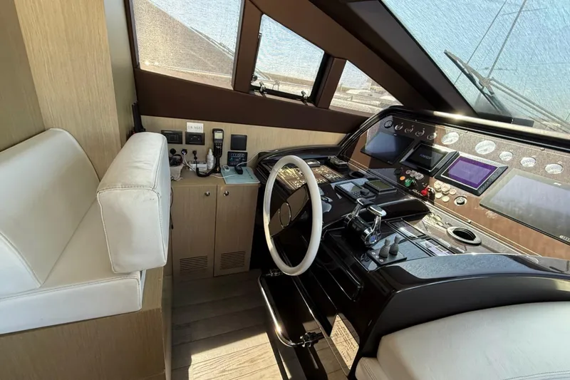  Yacht Photos Pics Interior cockpit of 2013 Riva 75 Venere Super yacht with modern controls and seating.