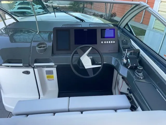  Yacht Photos Pics 2022 Aviara AV 32-OB boat helm with modern controls and sleek design.