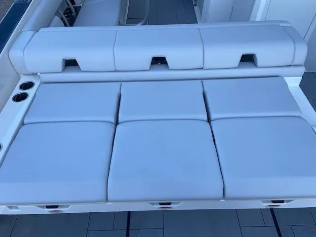  Yacht Photos Pics 2022 Aviara AV 32-OB boat seating, featuring luxurious white cushions and cup holders.