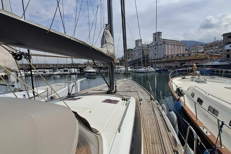  Yacht Photos Pics Sailing yacht CNB BORDEAUX 60, 2009 model, docked in a bustling marina.