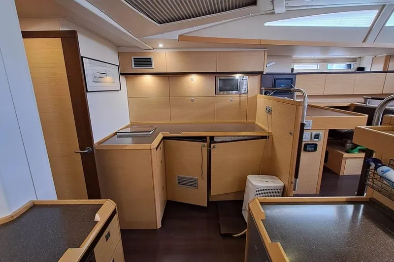  Yacht Photos Pics Luxurious interior of 2009 CNB BORDEAUX 60 yacht with modern kitchen design.