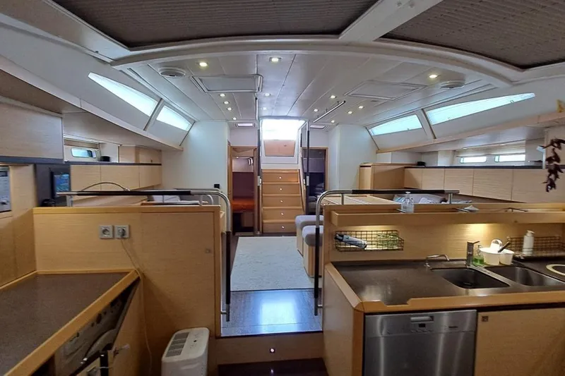  Yacht Photos Pics Luxurious interior of 2009 CNB BORDEAUX 60 yacht with modern kitchen and seating area.