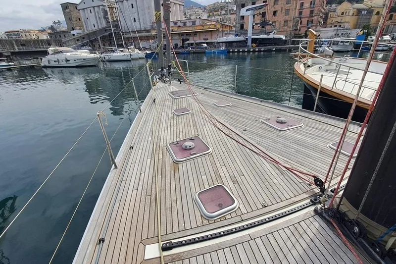  Yacht Photos Pics Deck of 2009 CNB BORDEAUX 60 yacht in a marina, showcasing sleek design and craftsmanship.