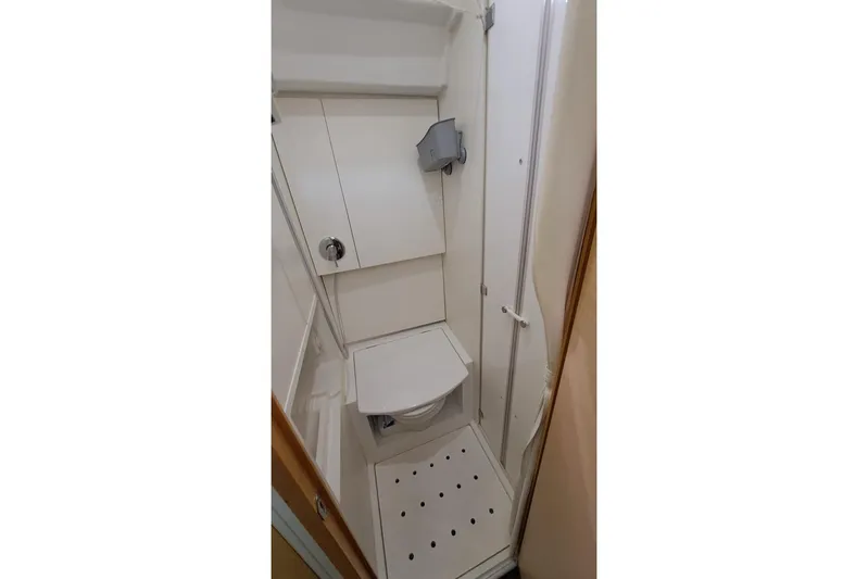  Yacht Photos Pics Compact bathroom in 2009 CNB BORDEAUX 60 yacht, featuring a modern toilet and shower.