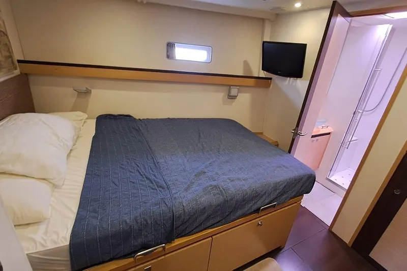  Yacht Photos Pics Luxurious bedroom in 2009 CNB BORDEAUX 60 yacht with ensuite bathroom and TV.