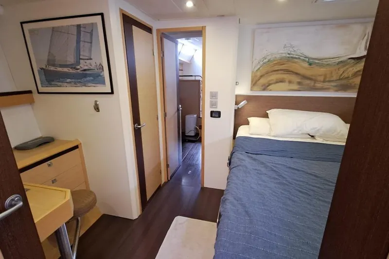  Yacht Photos Pics Luxurious cabin interior of 2009 CNB BORDEAUX 60 yacht with bed and artwork.