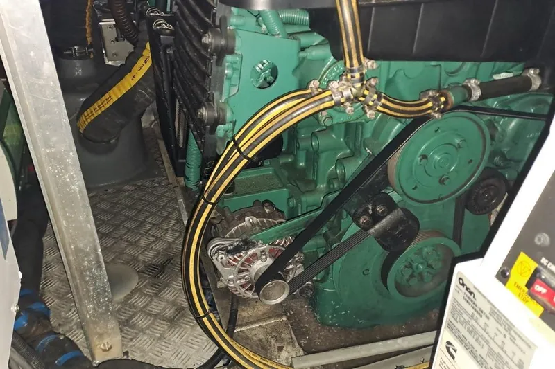  Yacht Photos Pics Engine compartment of a 2009 CNB BORDEAUX 60 yacht, featuring mechanical components and wiring.