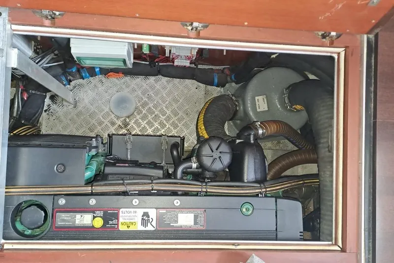  Yacht Photos Pics Engine compartment of a 2009 CNB BORDEAUX 60 yacht, showcasing mechanical components and wiring.