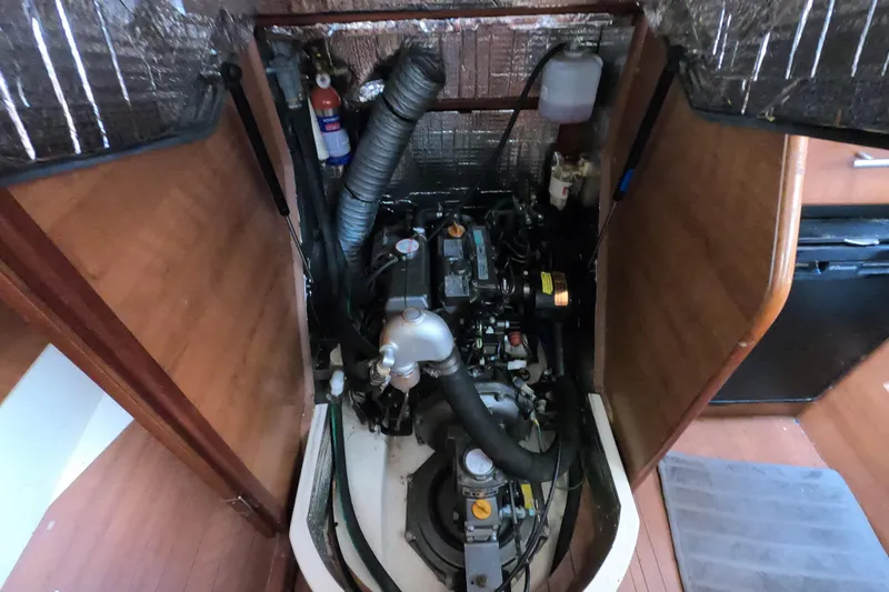 Moon Shadow Yacht Photos Pics Engine compartment of a 2013 Marlow-Hunter e33 sailboat, showcasing mechanical components.