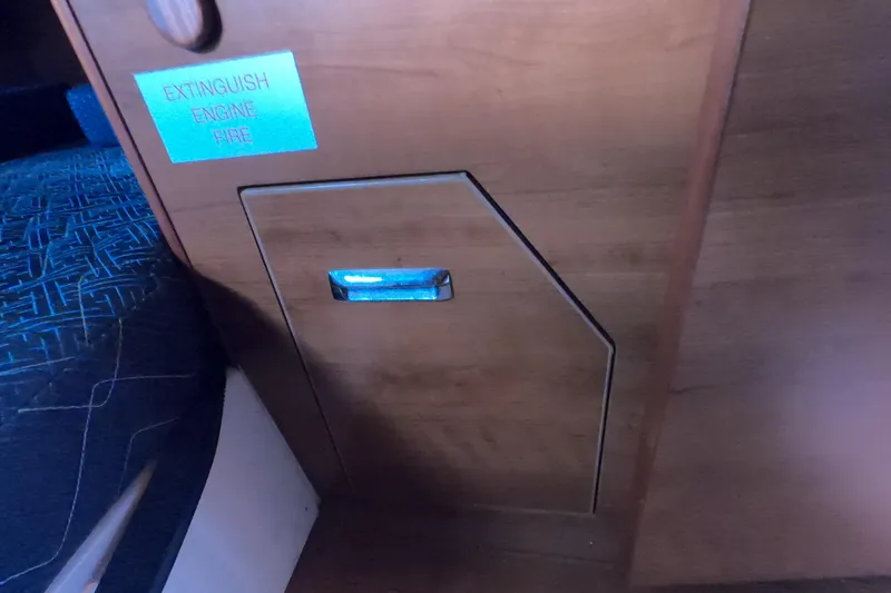 Moon Shadow Yacht Photos Pics 2013 Marlow-Hunter e33 interior with engine fire extinguisher access panel.